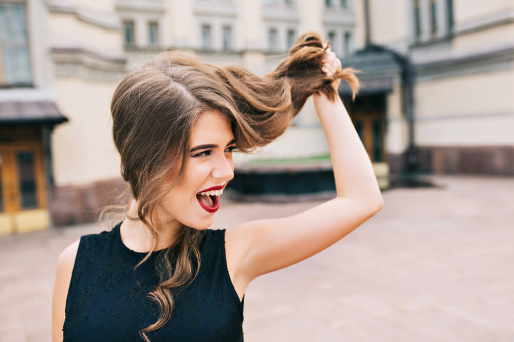 Woman holding hair