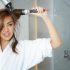 Woman creating hair dryer styles