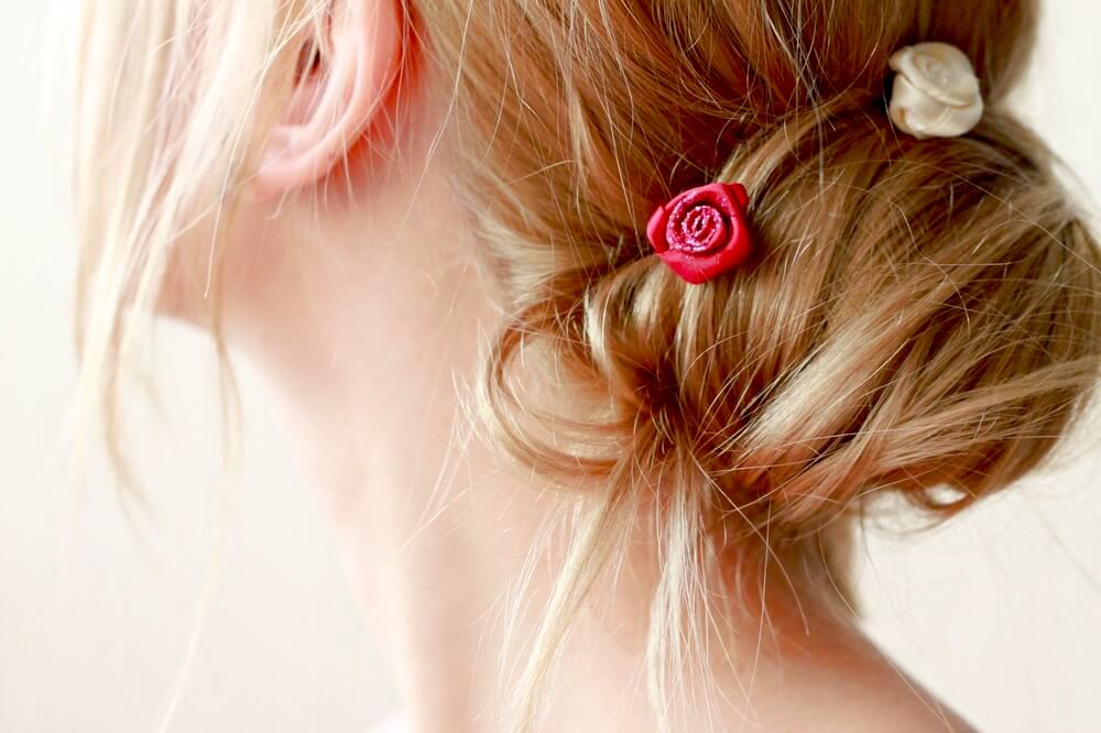 Woman's hair with flower petals