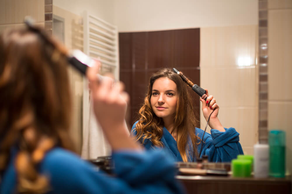 woman curling hair