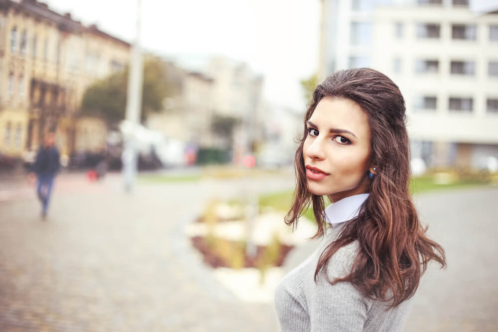 woman walking looking back