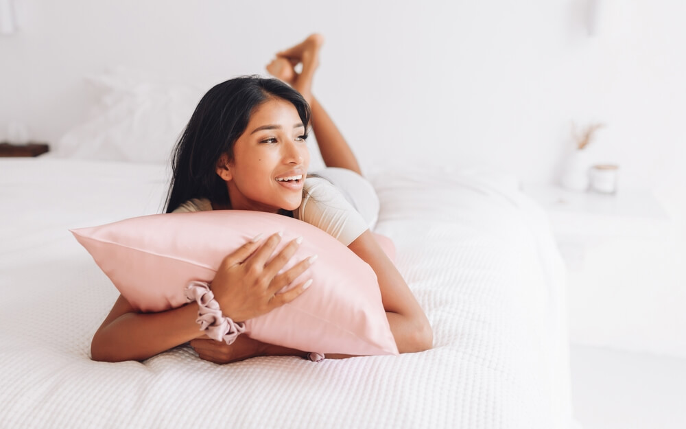 woman laying with pillow