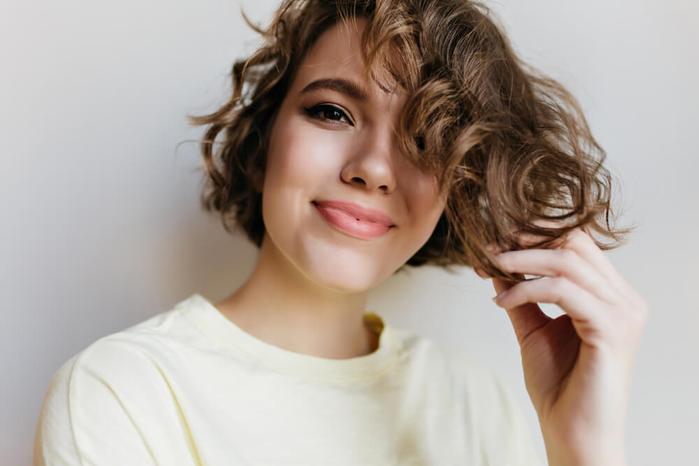 Woman with curly shag haircut